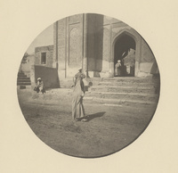 Veiled woman in front of the Shāh-i Zindah mausoleum in Samarkand