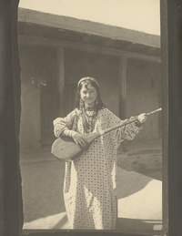 Young Sart girl playing the dutar